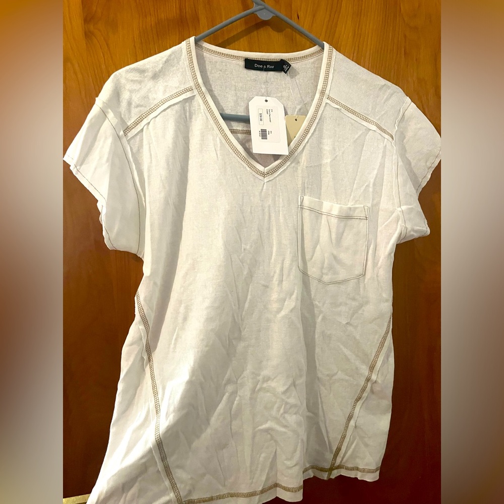 White t shirt, light brown exposed stitch